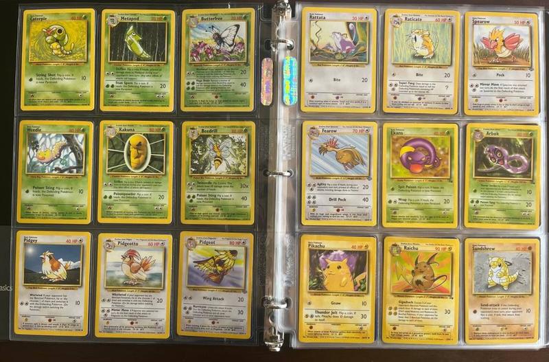 A binder page of vintage Pokemon cards in a collector's album
